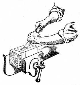 Fig. 184.Removing Waste of Mortise with Chisel.